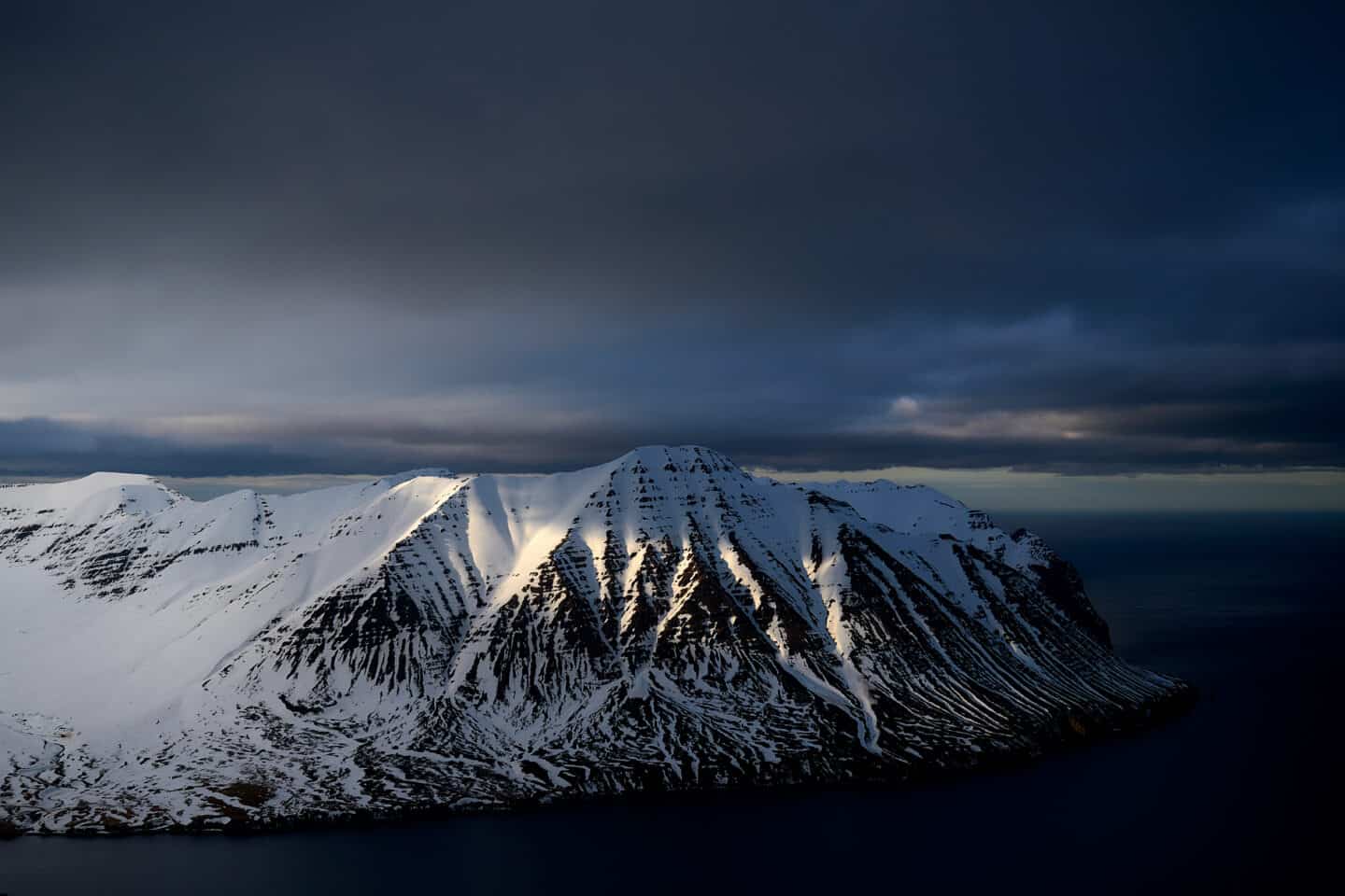 fjords trollpeninsula winter snow iceland dark sky
